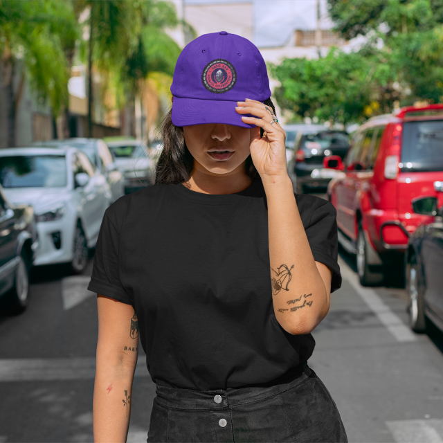 mockup-of-a-woman-standing-in-the-street-wearing-a-t-shirt-and-a-dad-hat-28608